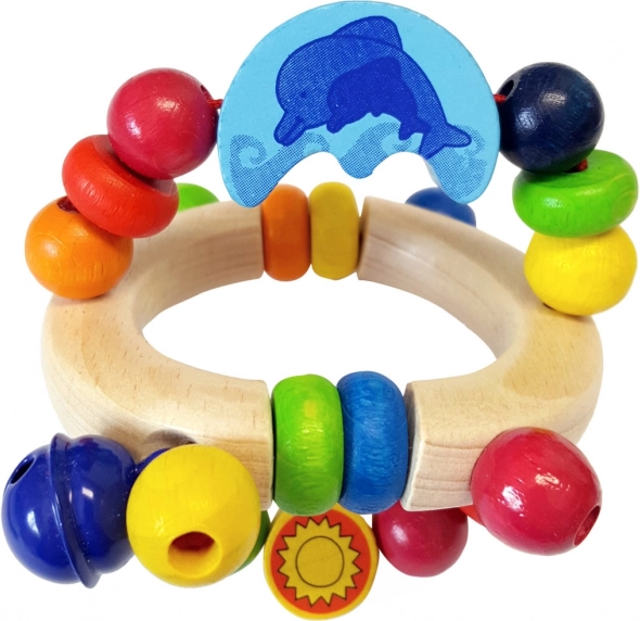 Drewniana grzechotka z delfinem