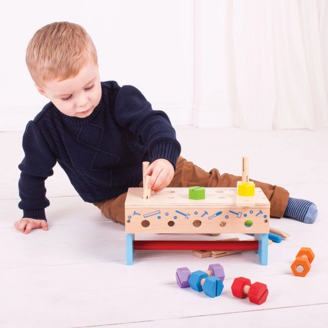 Drewniany stolik warsztatowy i skrzynka na narzędzia 2w1 Bigjigs Toys