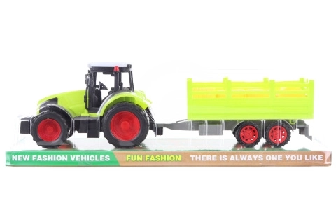 Plastowy traktor z przyczepą do przewożenia bel