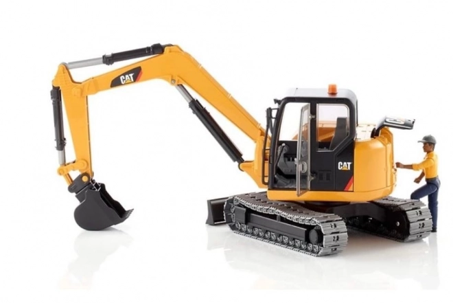 Bruder Minikoparka CAT z figurką