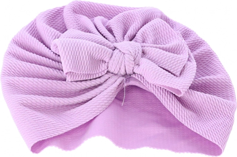 Urocza kokarda i turbanowy krój