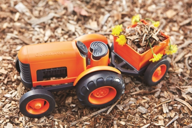 Pomarańczowy traktor z przyczepą od Green Toys