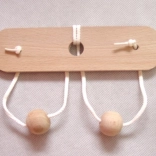 Drewniana łamigłówka Piersi